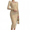 Core spun knitted long sleeved dress with V-neck slimming and black mid length slit buttocks skirt