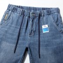 Elastic waisted men's denim shorts, loose and oversized, classic blue straight leg washed jeans 